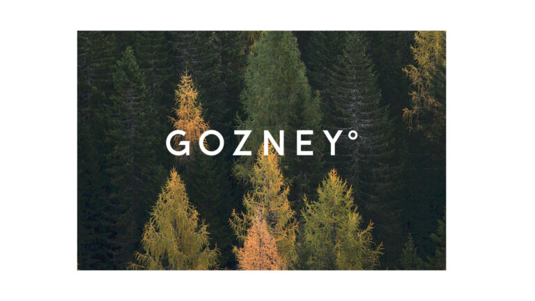 The Gozney logo overlaid on a forest backdrop